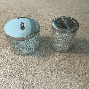 silver bathroom accessories; toothbrush holder; jar